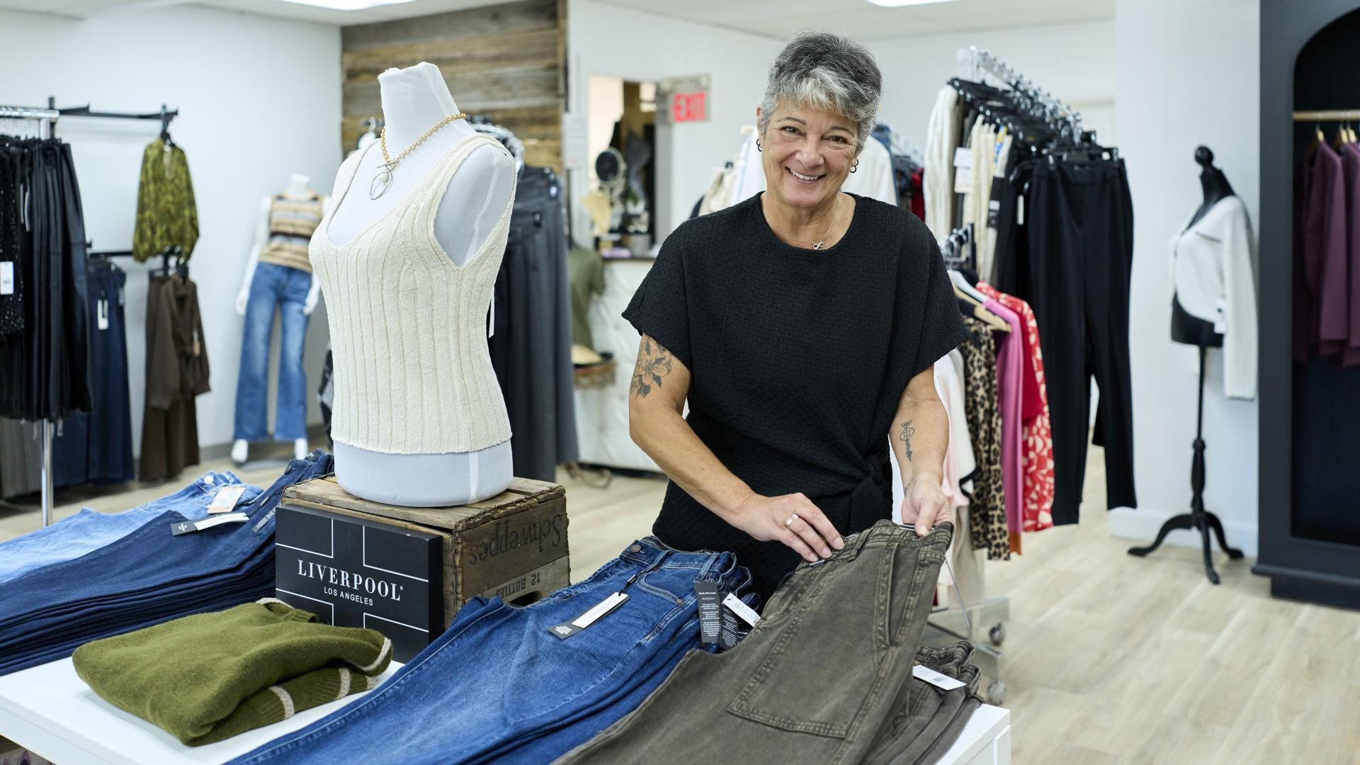 Staff in retail clothing store