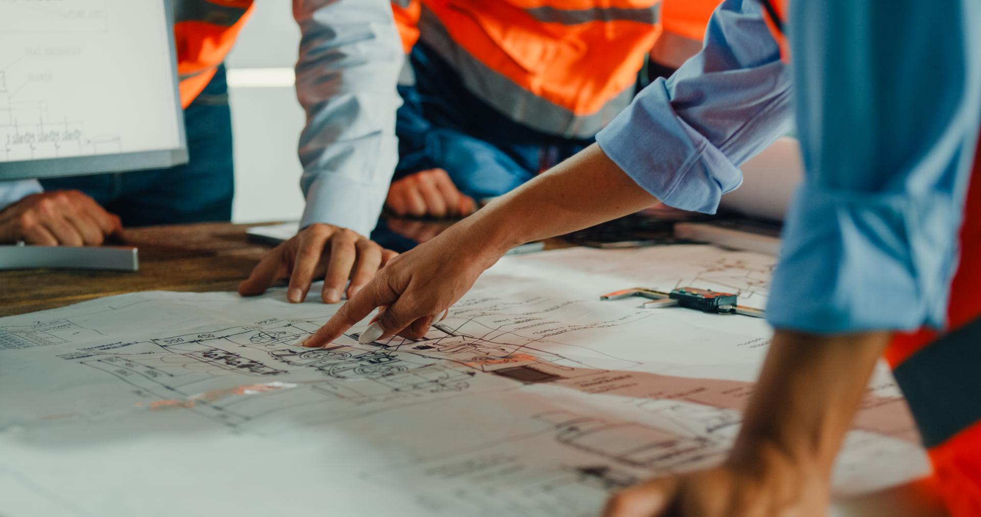 team looking at plans